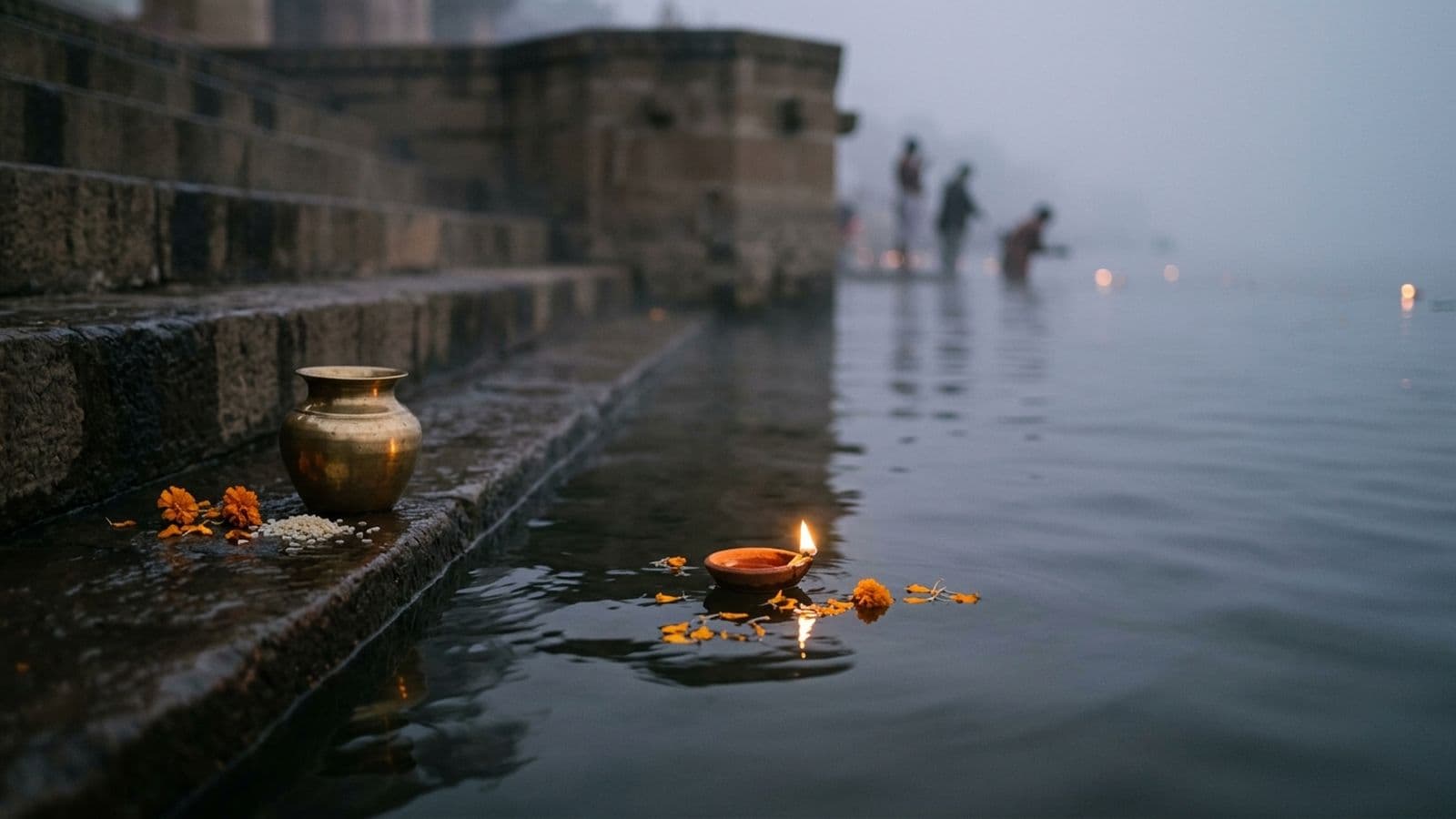 A devotee taking the Kartik holy bath at a river ghat at dawn, offering water in tarpan on Kartik Amavasya