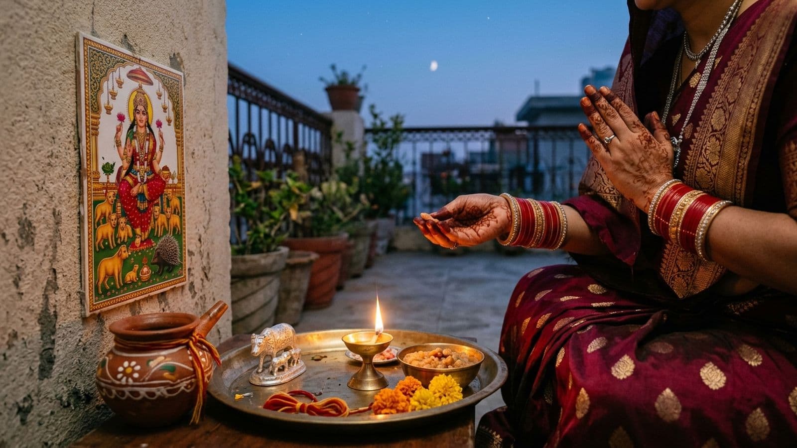 A mother offering argh from a karwa to the first stars at dusk on Ahoi Ashtami, an Ahoi Mata wall-painting with her cubs behind her