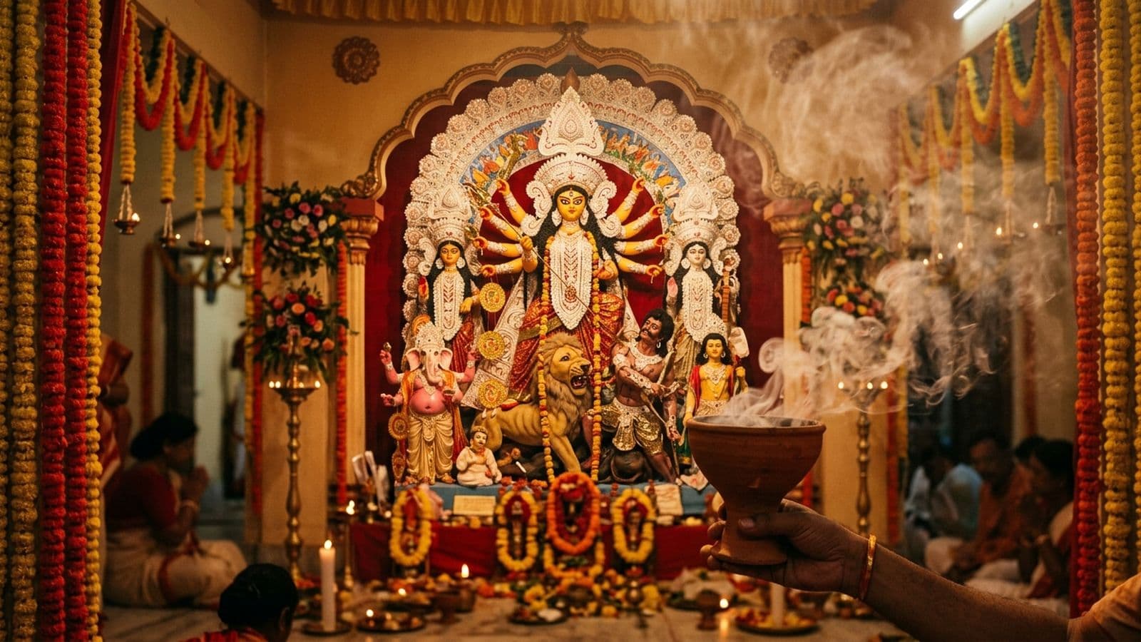 A clay Durga murti as Mahishasura Mardini with her children in a Bengal pandal, decorated for Durga Puja
